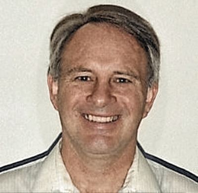 Restored and colorized (AI-assisted); faces are the original photo, colours are a best guess. Thomas Alan Caffey, portrait in later life.