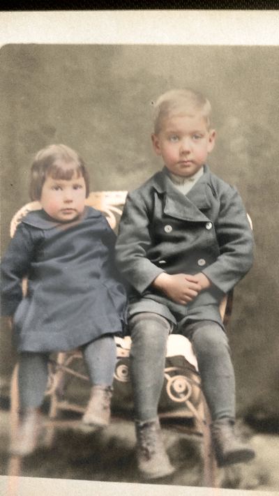 Restored and colorized (AI-assisted); faces are the original photo, colours are a best guess. Francis and Horace Glenn Coffman as small children (children of James David and Lydia Mae Coffman).