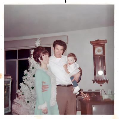 Bill and Nancy Proeger with Earl at Christmas, c. 1968