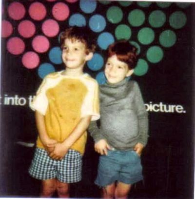 Damon and Mark Proeger in front of a polka-dot backdrop