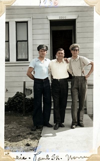 Restored and colorized (AI-assisted); faces are the original photo, colours are a best guess. Paul A., Paul W. and Warren DeBelling outside a house, 1936 (names written on the print).