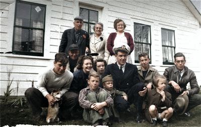 Restored and colorized (AI-assisted); faces are the original photo, colours are a best guess. Earl T. Roberts — c. 1940s.