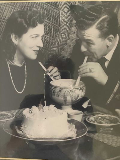 Aileane Marie Silva and Earl T. Roberts at a cake table
